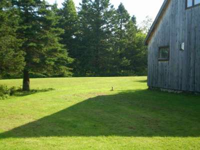 Side of cottage, looking West